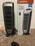 Lasko 1500W Ceramic Tower Heater Oscillating W/ Remote, Timer, Gray New. Price: $52.00.