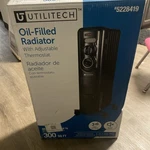 Utilitech Oil-filled Radiator Adjustable Thermostat Black Model 5228419 Wheels Open. Price: $47.99.