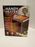 Handy Heater Pure Warmth Ceramic Space 1200 Watts Auto Off Tip New. Price: $33.25.