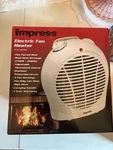 Impress Electric Fan Heater Model IM-701 New. Price: $18.98.