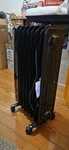 Pelonis NY1507-14A Oil-filled Radiator Heater 1500W 120V Black Digital Timer New. Price: $100.00.