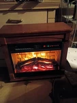 26" Portable Infrared Rolling Mantel Fireplace Realistic 3D Flame Used. Price: $56.00.
