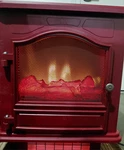 Twin Star Home's Maroon Electric Portable Heater Faux Fireplace Dual Used. Price: $40.00.