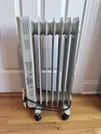 Optimus Portable 7 Fin Oli Filled Radiator 1500W Heater, Used 120VAC. Price: $23.00.