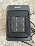Black Aikoper NTH15-20A 1500W Ceramic Tower Heater Open. Price: $12.99.