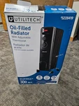 Utilitech 1500W Oil Filled Radiant Electric Space Heater Adjustable Thermostat Open. Price: $30.00.